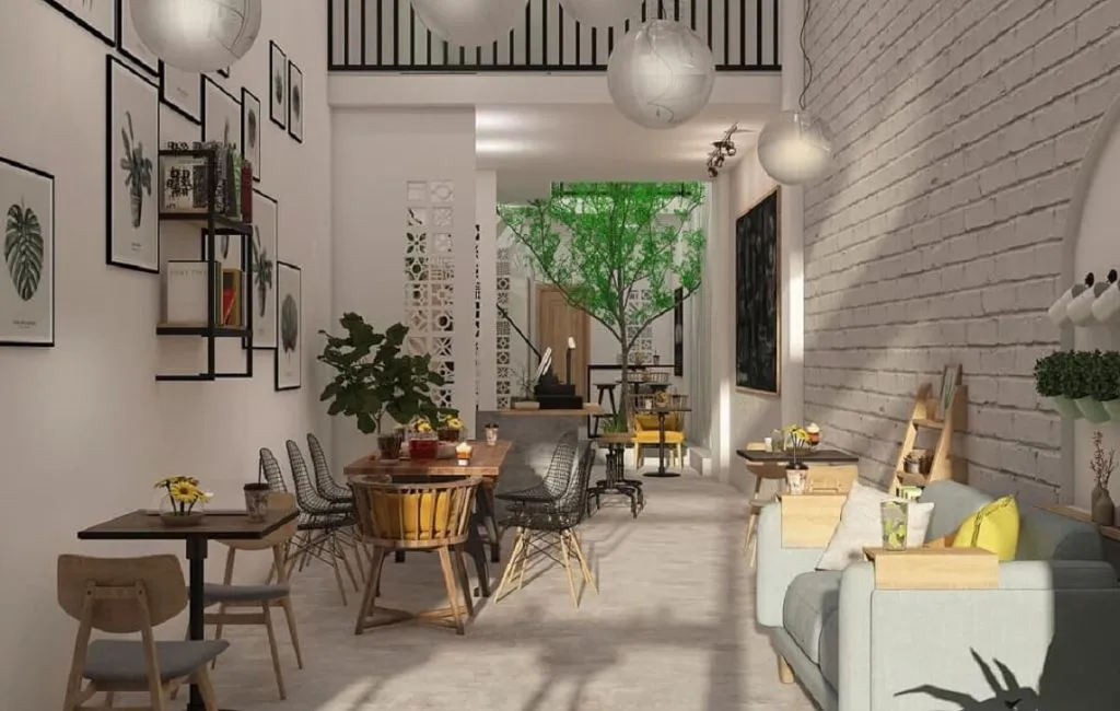 Áp dụng màu sắc ấm áp từ gỗ và ánh sáng vàng để tạo sự thân mật, một trong những cách trang trí quán cà phê diện tích nhỏ thu hút khách hàng